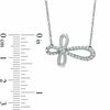 Thumbnail Image 1 of 0.25 CT. T.W. Diamond Sideways Loop Cross Necklace in Sterling Silver