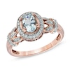Thumbnail Image 0 of Oval Aquamarine and 0.16 CT. T.W. Diamond Frame Vine Ring in 10K Rose Gold
