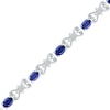 Thumbnail Image 0 of Oval Lab-Created Blue and White Sapphire Bracelet in Sterling Silver - 7.5"