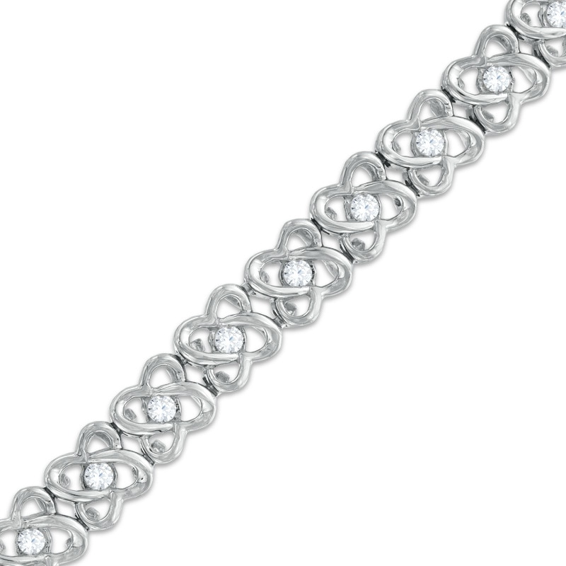 0.95 CT. T.W. Diamond Orbit Flower Link Bracelet in 10K White Gold - 7.25"