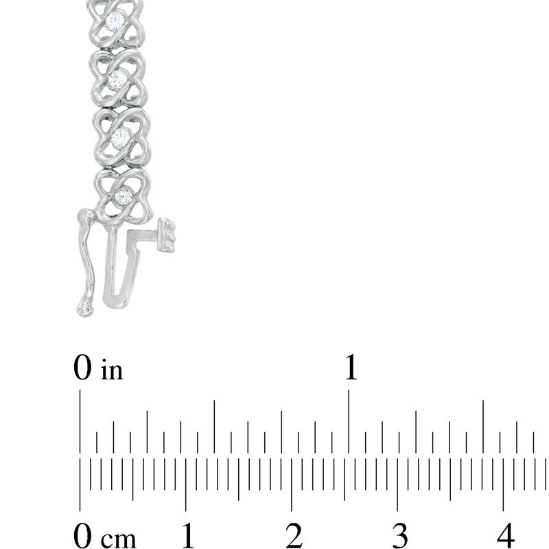 0.95 CT. T.W. Diamond Orbit Flower Link Bracelet in 10K White Gold - 7.25"