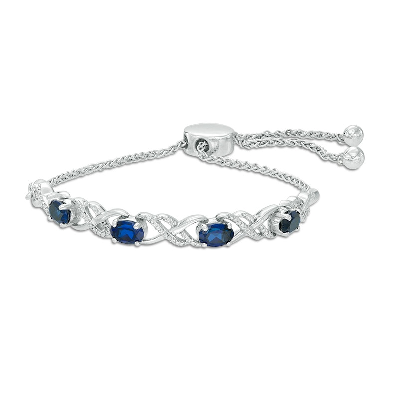 Oval Lab-Created Blue Sapphire and 0.09 CT. T.W. Diamond Infinity Bolo Bracelet in Sterling Silver - 9.5"