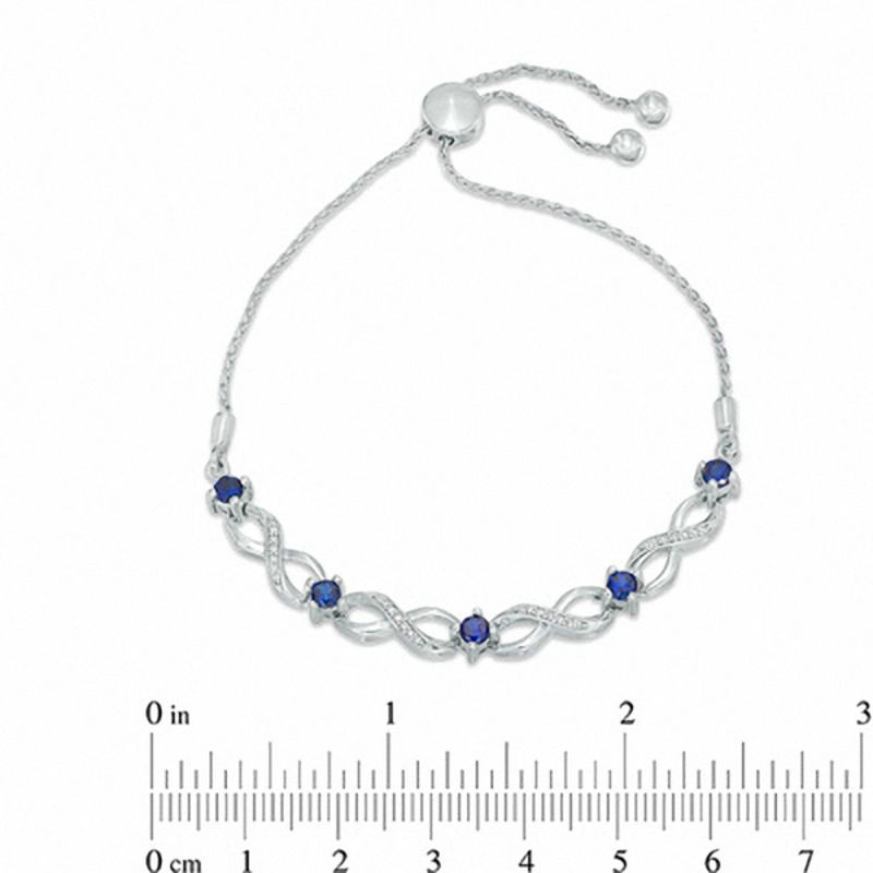 Lab-Created Blue Sapphire and 0.09 CT. T.W. Diamond Five Stone Infinity Bolo Bracelet in Sterling Silver - 9.5"