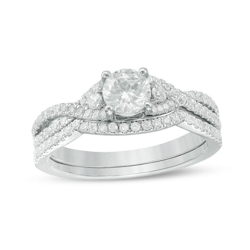0.88 CT. T.W. Certified Canadian Diamond Twist Bridal Set in Platinum (H/VS2)