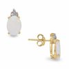 Thumbnail Image 1 of Oval Opal Earrings in 10K Gold with Tri-Top Diamond Accents