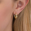 Thumbnail Image 1 of 0.25 CT. T.W. Channel-Set Diamond Oval Hoop Earrings in 10K Gold