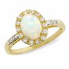 Thumbnail Image 0 of Oval Lab-Created Opal and White Sapphire Ring in 14K Gold with Diamond Accents