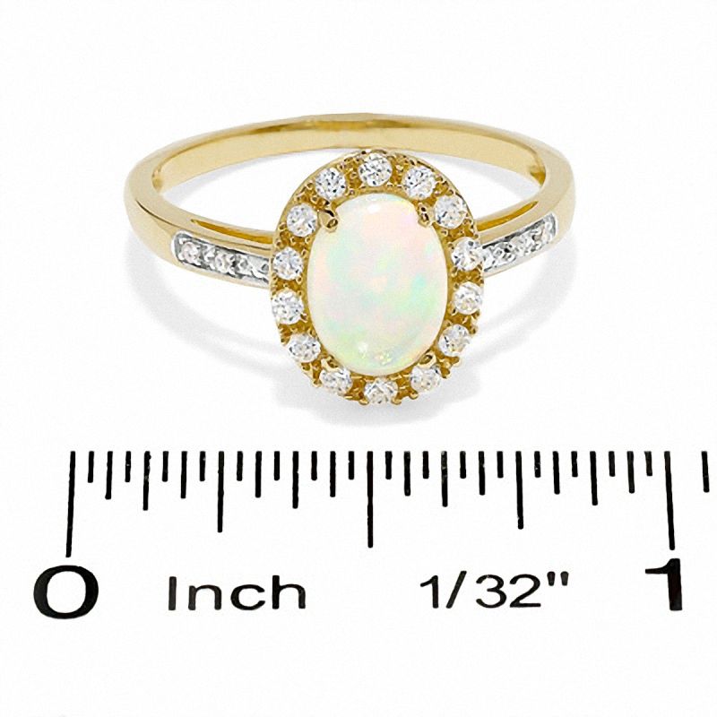 Main Image 3 of Oval Lab-Created Opal and White Sapphire Ring in 14K Gold with Diamond Accents