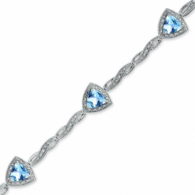 Main Image 1 of 6.0mm Trillion-Cut Blue Topaz and Diamond Accent Bracelet in Sterling Silver - 7.25"