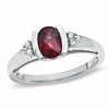 Thumbnail Image 1 of Oval Garnet and White Sapphire Bezel-Set Ring in 10K White Gold