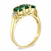 Thumbnail Image 1 of Oval Emerald and Diamond Accent Three Stone Ring in 10K Gold