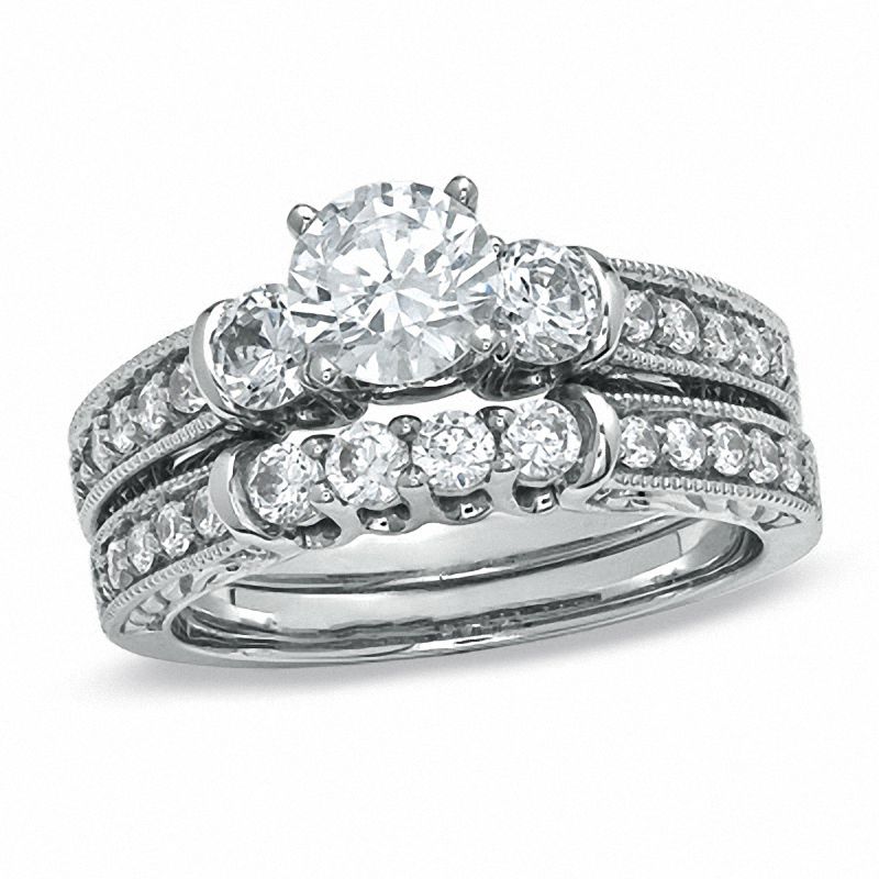 0.87 CT. T.W. Diamond Three Stone Bridal Set in 14K White Gold