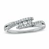 Thumbnail Image 1 of 0.16 CT. T.W. Diamond Three Stone Swirl Bypass Ring in 10K White Gold