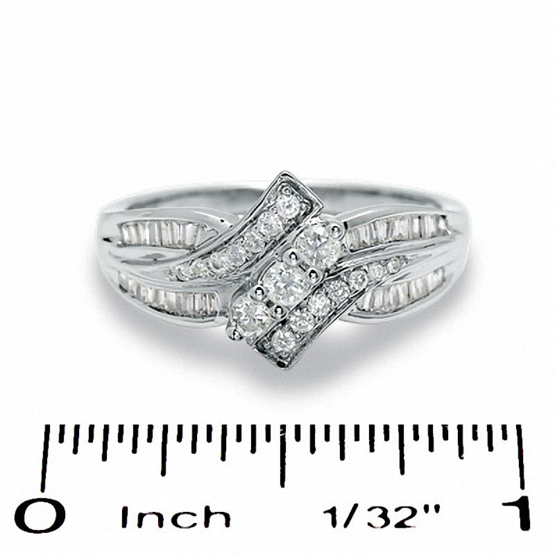 0.50 CT. T.W. Diamond Bypass Three Stone Ring in 10K Gold