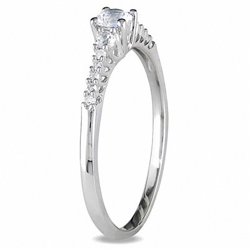 White Lab-Created Sapphire and 0.05 CT. T.W. Diamond Promise Ring in Sterling Silver