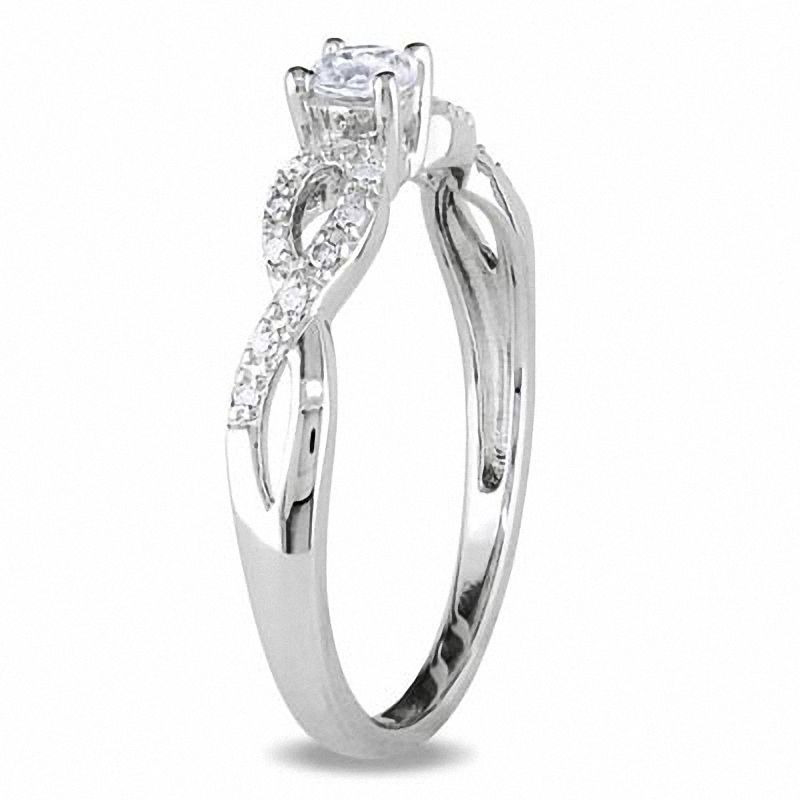 Main Image 2 of White Lab-Created Sapphire and 0.08 CT. T.W. Diamond Twist Shank Promise Ring in Sterling Silver