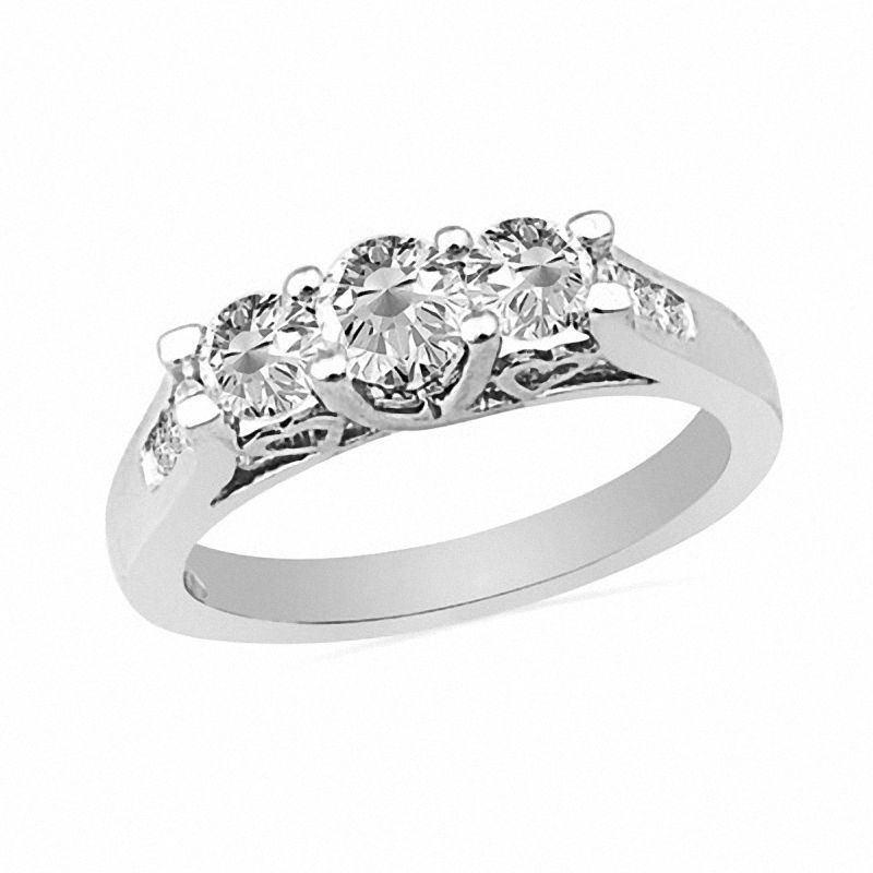 0.50 CT. T.W. Diamond Three Stone Ring with Heart Accents in 10K White Gold