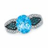 Thumbnail Image 0 of Oval Swiss Blue Topaz and 0.27 CT. T.W. Enhanced Blue and White Diamond Ring in 10K White Gold