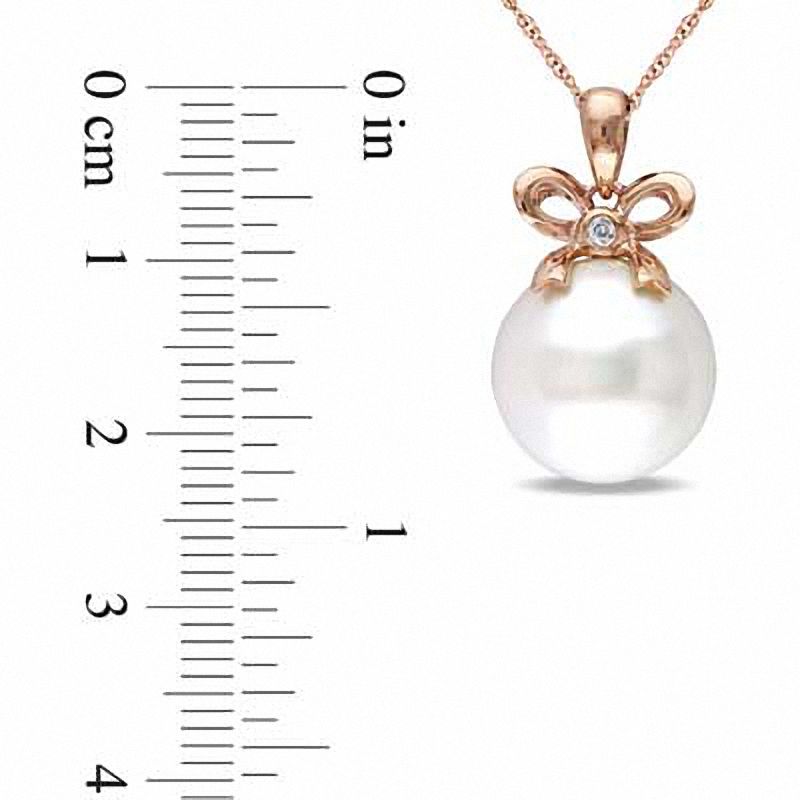 Main Image 2 of 12.0-12.5mm Freshwater Cultured Pearl and Diamond Accent Bow Pendant in 10K Rose Gold-17"