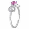Thumbnail Image 1 of Pink Sapphire and 0.19 CT. T.W. Diamond Bow Ring in 10K White Gold
