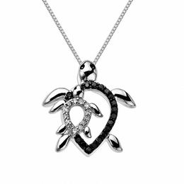 0.12 CT. T.W. Black and White Diamond Motherly Love Turtle Pendant in Sterling Silver