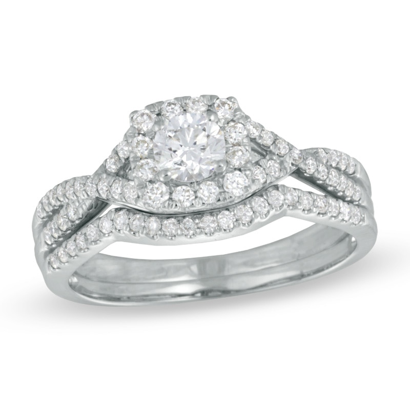Main Image 1 of 0.70 CT. T.W. Certified Canadian Diamond Twist Shank Bridal Set in 14K White Gold (I/I1)