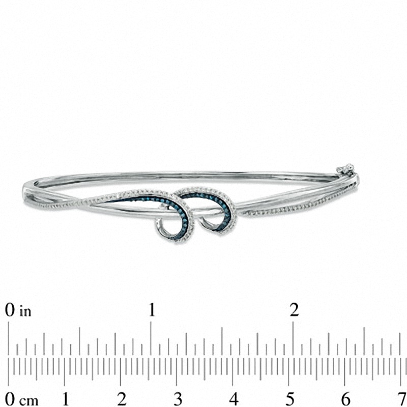 0.33 CT. T.W. Enhanced Blue and White Diamond Twist Bangle in Sterling Silver