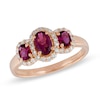 Thumbnail Image 0 of Oval Rubellite and 0.23 CT. T.W. Diamond Three Stone Ring in 10K Rose Gold