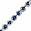 Thumbnail Image 1 of Oval Blue Lab-Created Sapphire and 0.075 CT. T.W. Diamond Bracelet in Sterling Silver - 7.5"