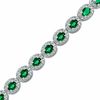 Thumbnail Image 0 of Oval Lab-Created Emerald and 0.075 CT. T.W. Diamond Bracelet in Sterling Silver - 7.5"