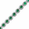 Thumbnail Image 1 of Oval Lab-Created Emerald and 0.075 CT. T.W. Diamond Bracelet in Sterling Silver - 7.5"