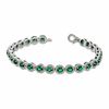 Thumbnail Image 1 of Oval Lab-Created Emerald and 0.075 CT. T.W. Diamond Bracelet in Sterling Silver - 7.5"