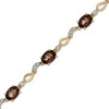 Thumbnail Image 1 of Oval Smoky Quartz and Diamond Accent Bracelet in 10K Gold - 7.25"