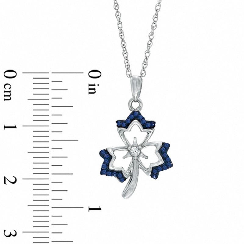 0.13 CT. T.W. Enhanced Blue and White Diamond Maple Leaf Pendant in 10K White Gold