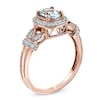 Oval Aquamarine and 0.16 CT. T.W. Diamond Frame Vine Ring in 10K Rose Gold