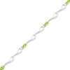 Thumbnail Image 1 of Oval Peridot and Diamond Accent Bracelet in Sterling Silver - 7.5"