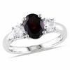 Thumbnail Image 0 of Oval Garnet and White Lab-Created Sapphire Three Stone Ring in Sterling Silver