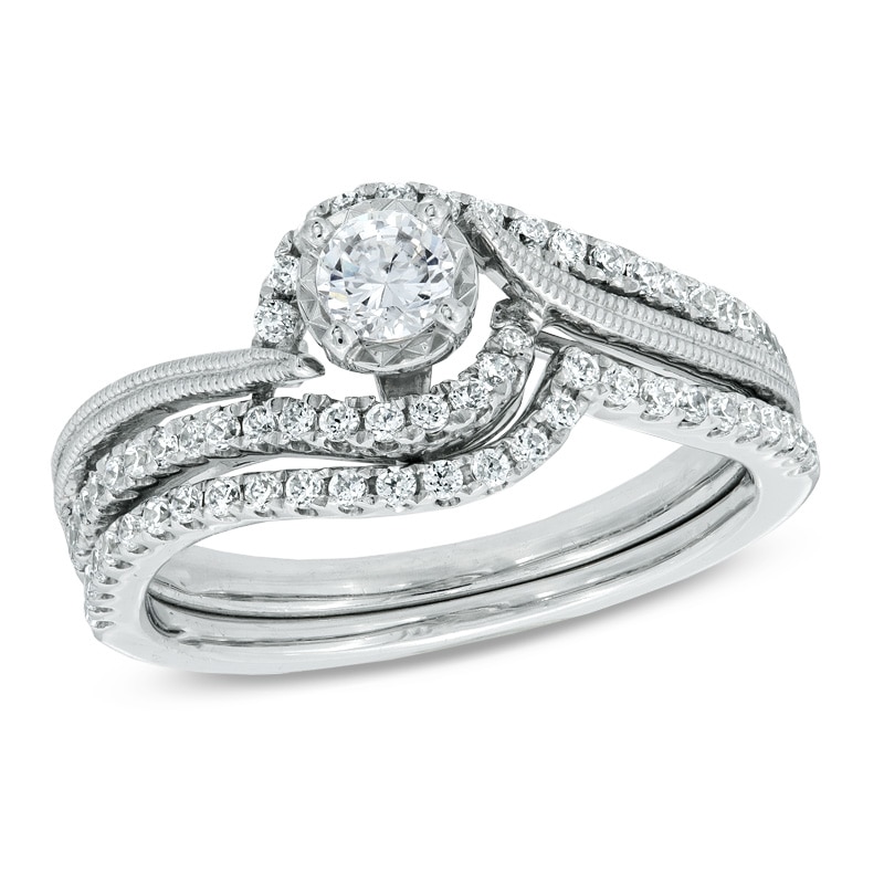 0.50 CT. T.W. Diamond Frame Swirl Bridal Set in 10K White Gold