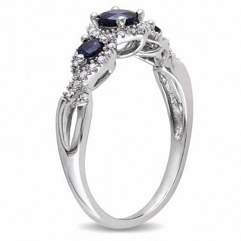 4.0mm Blue Sapphire and 0.12 CT. T.W. Diamond Three Stone Ring in 10K White Gold
