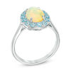 Thumbnail Image 1 of Oval Yellow Opal and Sky Blue Topaz Frame Ring in 10K White Gold