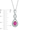 Thumbnail Image 1 of Oval Lab-Created Ruby and Diamond Accent Infinity Twist Pendant in Sterling Silver