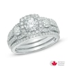 1.56 CT. T.W. Certified Canadian Diamond Three Stone Frame Engagement Ring in 14K White Gold (I/I2)