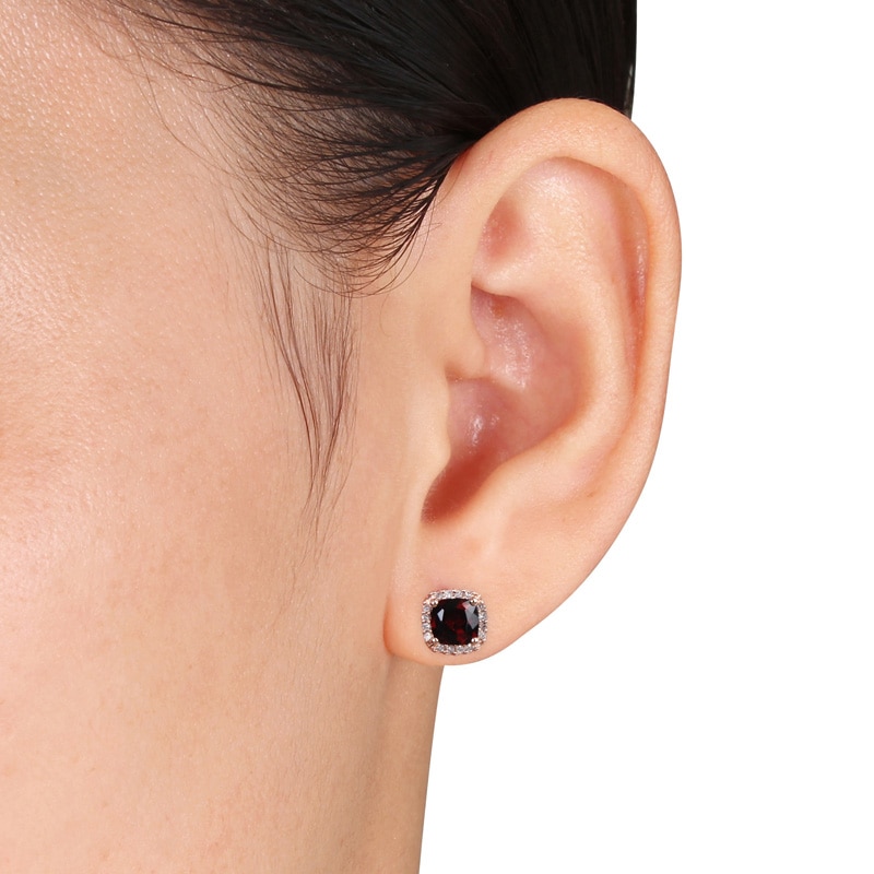 Main Image 3 of 5.0mm Cushion-Cut Garnet and 0.09 CT. T.W. Diamond Stud Earrings in 10K Rose Gold