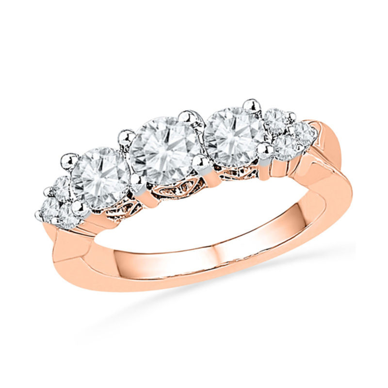 5.2mm Lab-Created White Sapphire and 0.12 CT. T.W. Diamond Three Stone Ring in 10K Rose Gold
