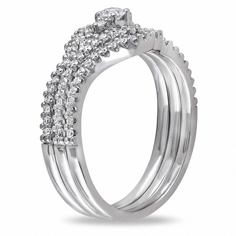 0.47 CT. T.W. Diamond Swirl Three Piece Bridal Set in 10K White Gold