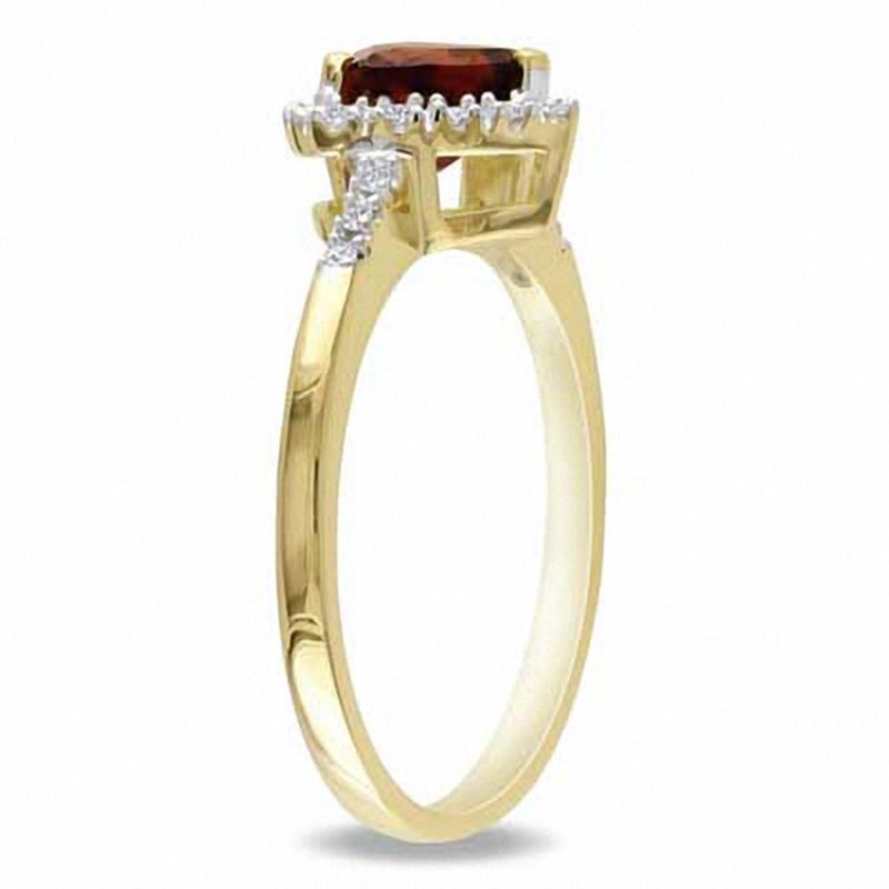Peoples 6.0mm Heart Shaped Garnet and 0.08 CT. T.w. Diamond Frame Ring in 10K