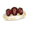 Thumbnail Image 0 of Oval Garnet and Diamond Accent Three Stone Ring in 10K Gold