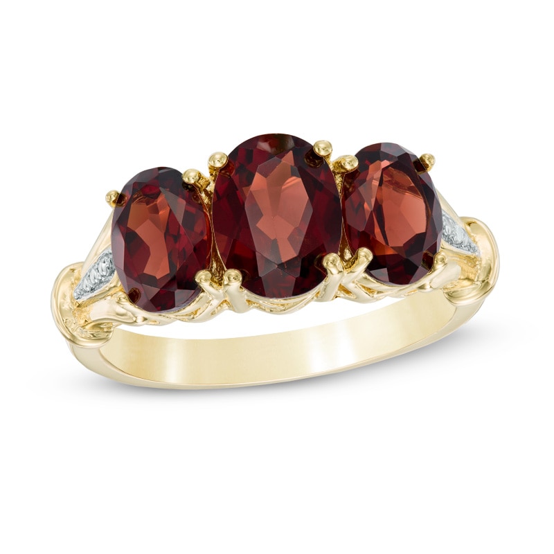 Oval Garnet and Diamond Accent Three Stone Ring in 10K Gold