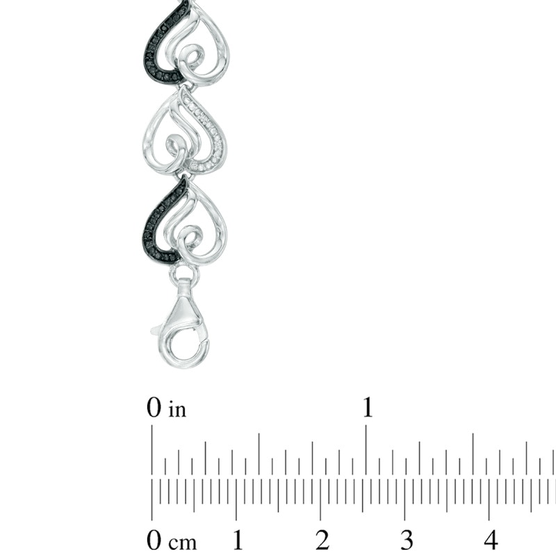 0.09 CT. T.W. Enhanced Black and White Diamond Curlique Heart Link Bracelet in Sterling Silver - 7.5"