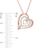 Thumbnail Image 1 of 0.11 CT. T.W. Diamond Triple Row Tilted Heart Pendant in 10K Tri-Tone Gold
